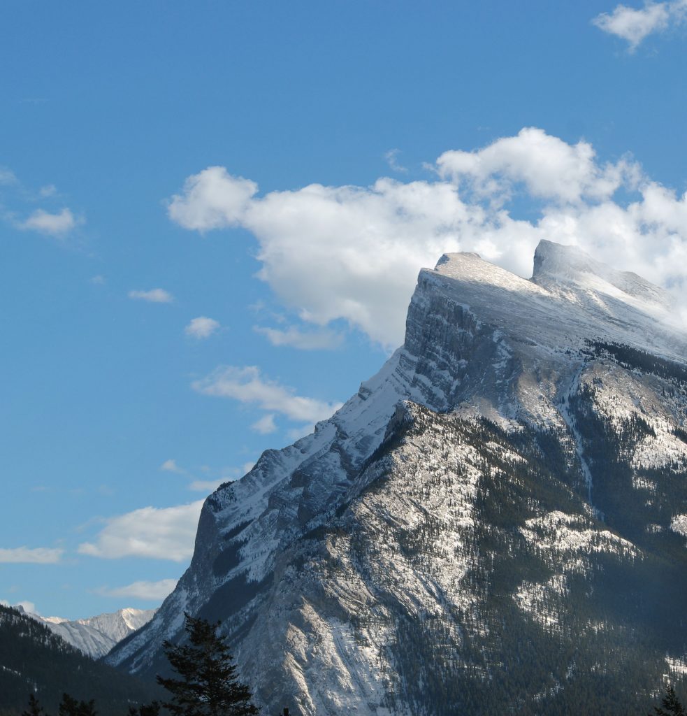A mountain peak under a blue sky