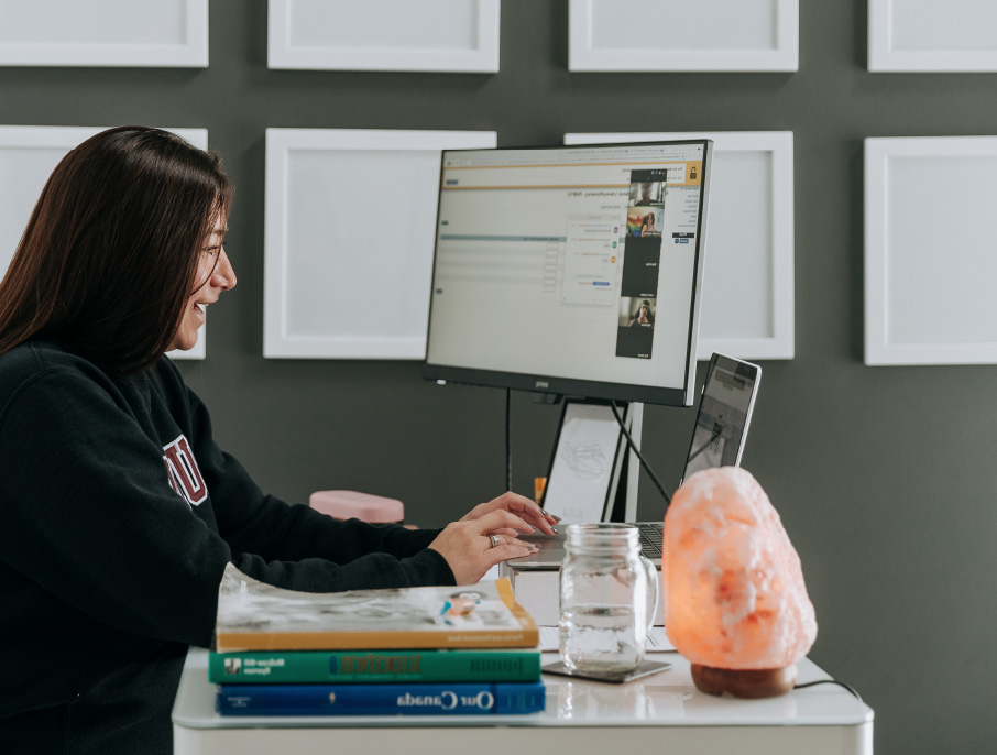 A woman working on a computer.