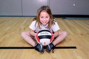 Jr. Cobras - girl playing with volleyball