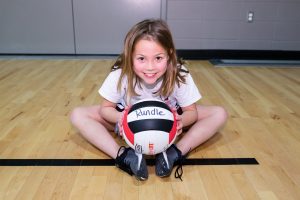 Best K-12 Private School in Calgary | Primary School Near Me | Jr. Cobras - Girl Playing with a Volleyball