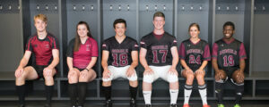 Six student athletes dressed in their sports gear