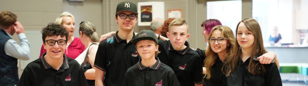 Rundle Studio | Rundle Studio students smile for a photo in the gymnasium | private school calgary