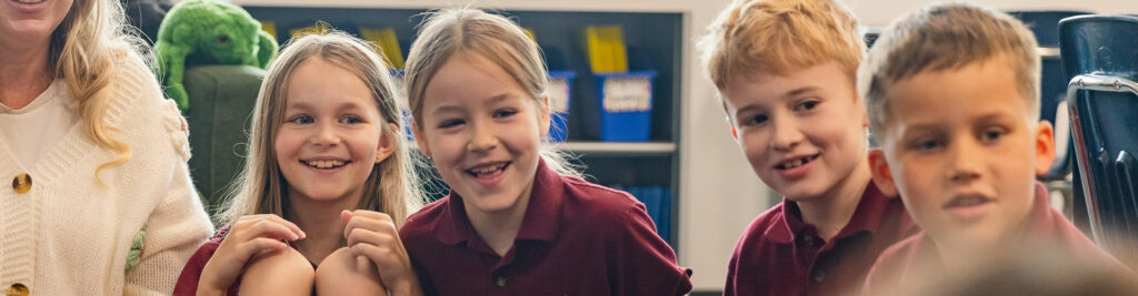 Rundle College | elementary students in French class smiling | private school calgary