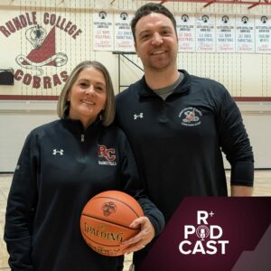 Laurel Adolphe and Travis Rasch stand holding a basketball in the Rundle gymnasium