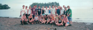 An archival Rundle photo of a group of students posing on a beach in Costa Rica.